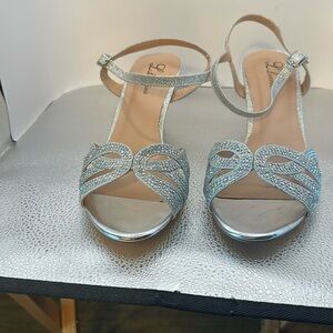 Lightly used heels. Absolutely beautiful with gems that look like diamonds.​